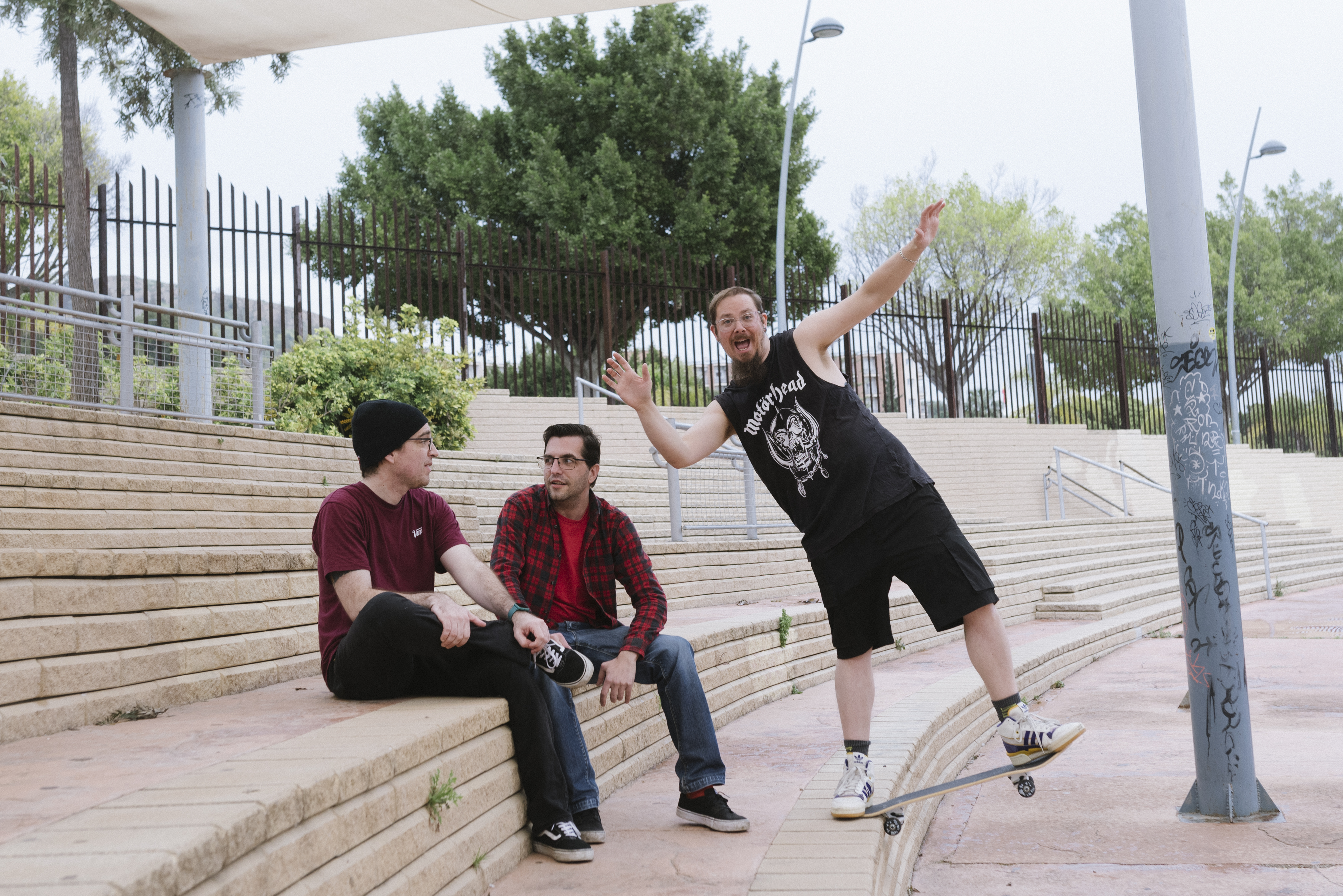 Behind the scenes shot of the band members during a promotional photo shoot