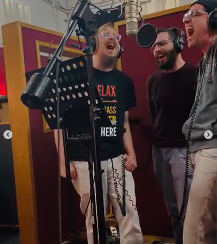 Photo of recording equipment and guitars in a professional music studio