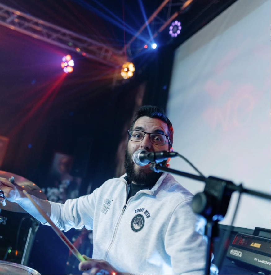 Wide shot of the audience cheering at an Alarm Alarm concert